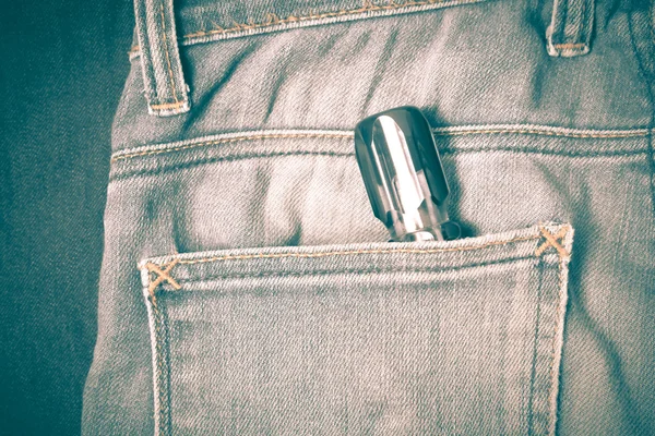 Screwdriver in jean pocket — Stock Photo, Image