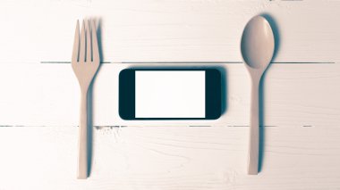 kaşık ve sosyal vintage tarzı yeme akıllı telefon genel kavram