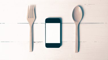kaşık ve sosyal vintage tarzı yeme akıllı telefon genel kavram