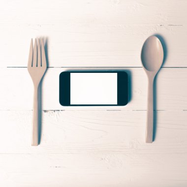 kaşık ve sosyal vintage tarzı yeme akıllı telefon genel kavram