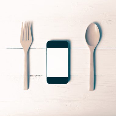 kaşık ve sosyal vintage tarzı yeme akıllı telefon genel kavram