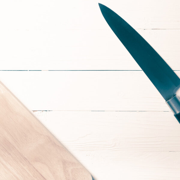 kitchen knife on cutting board vintage style