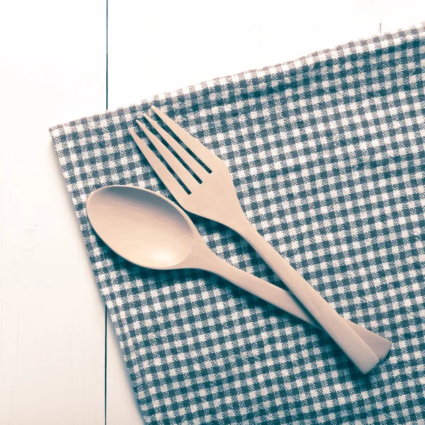 Wood spoon and fork on kitchen towel vintage style — Stock Photo, Image