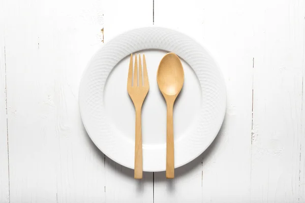 wood spoon and fork with dish