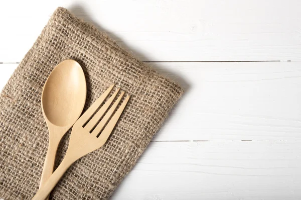 wood spoon and fork on kitchen towel