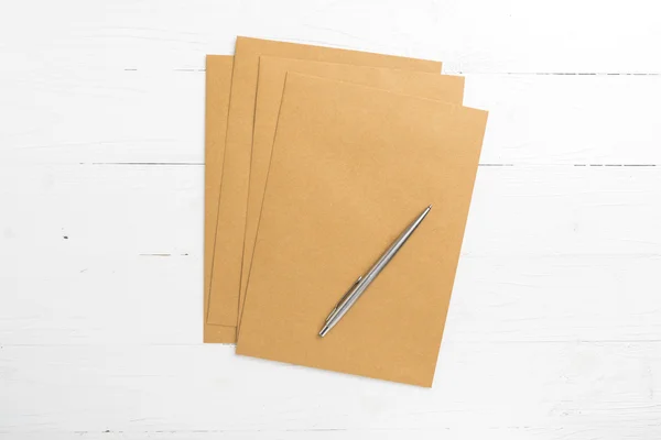 Brown paper with pen — Stock Photo, Image