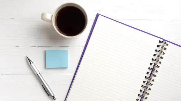 Notepad and coffee cup — Stock Photo, Image