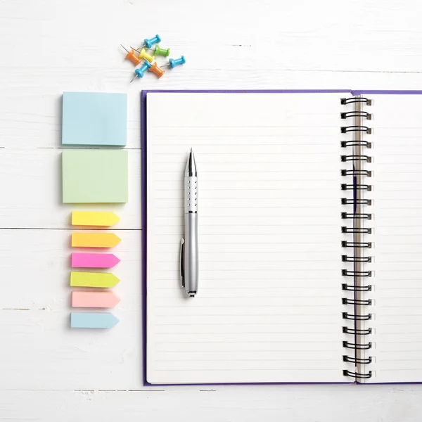 Notepad with office supplies — Stock Photo, Image