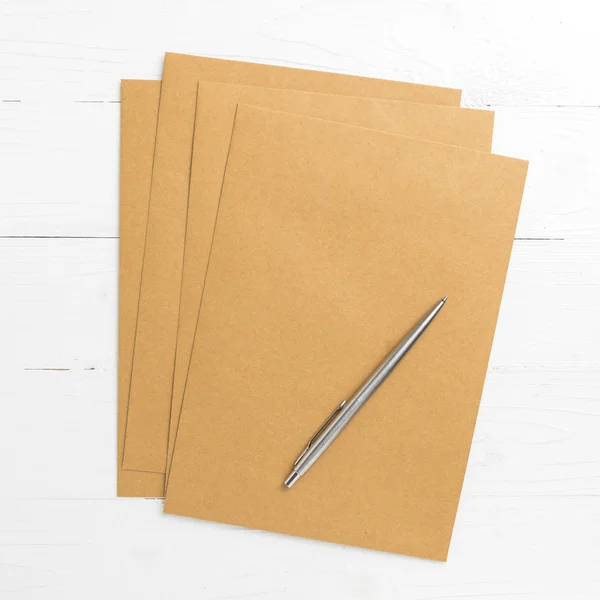 Brown paper with pen — Stock Photo, Image