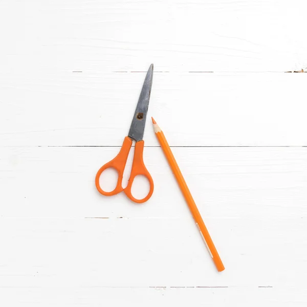 Orange scissors and pencil — Stock Photo, Image