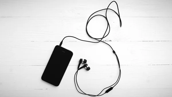 Mobilní telefon sluchátko černé a bílé barvy tónu stylem — Stock fotografie