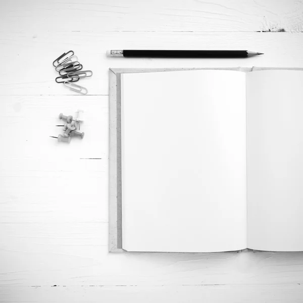 Notebook with office supplies black and white tone color style — Stock Photo, Image