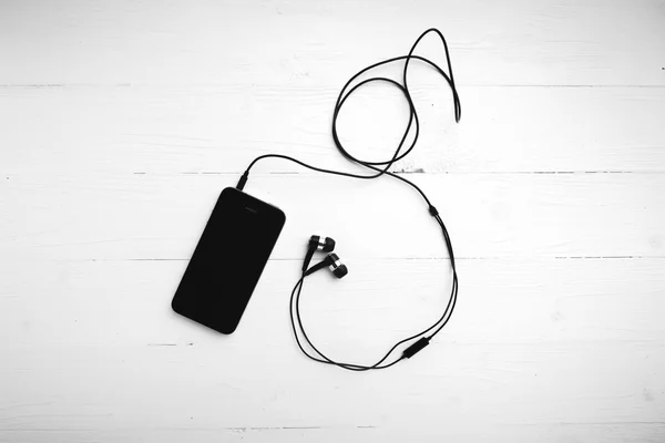 Mobilní telefon sluchátko černé a bílé barvy tónu stylem — Stock fotografie