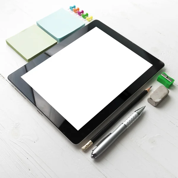 tablet with office supplies