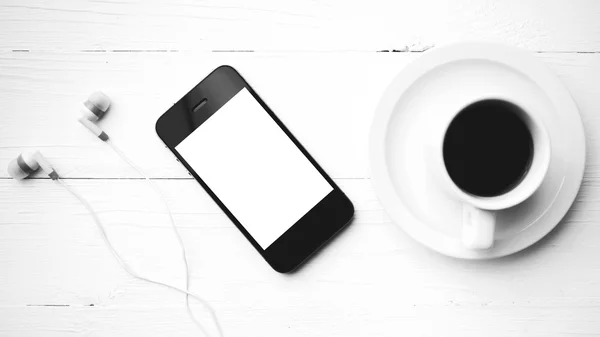 Cellphone and coffee cup black and white color style — Stock Photo, Image