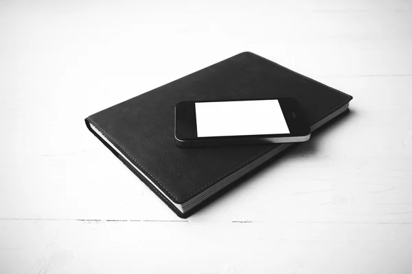 Cellphone and notebook black and white color style — Stock Photo, Image