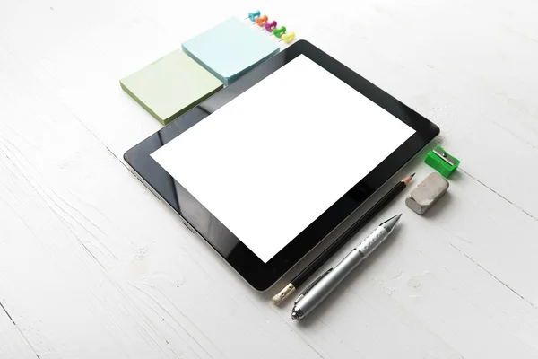 tablet with office supplies