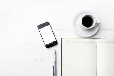 cep telefonu ile defter ve kahve Kupası