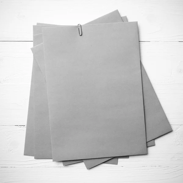 Brown paper with green paper clip black and white color — Stock Photo, Image