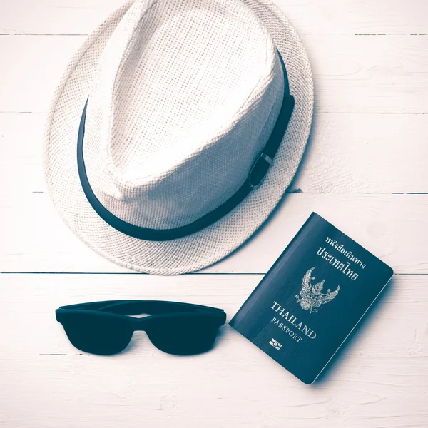 hat sunglasses and passport vintage style