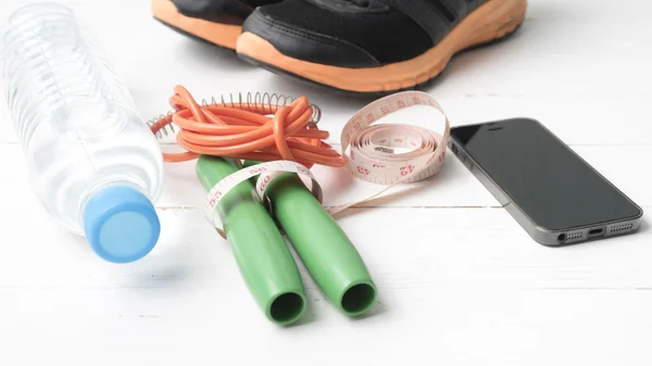 Fitness equipment on white wood table — Stock Photo, Image