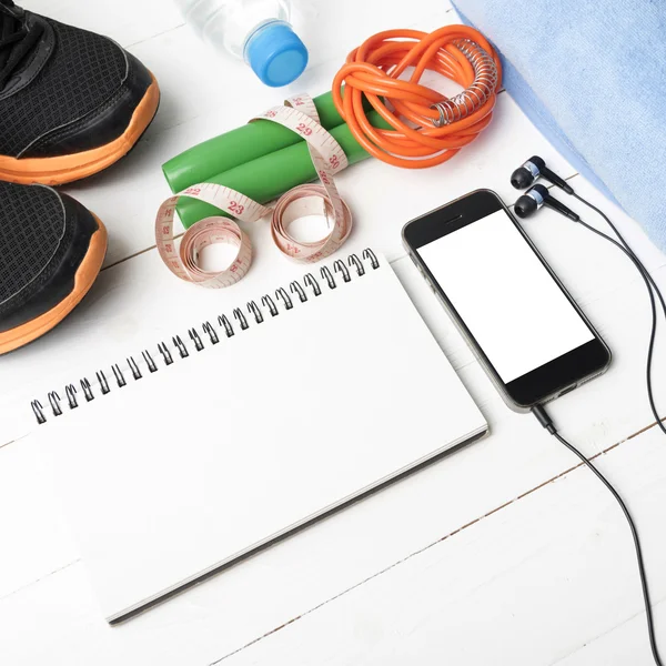 fitness equipment on white wood table