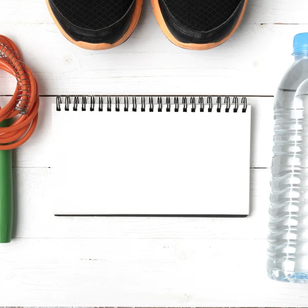 fitness equipment on white wood table