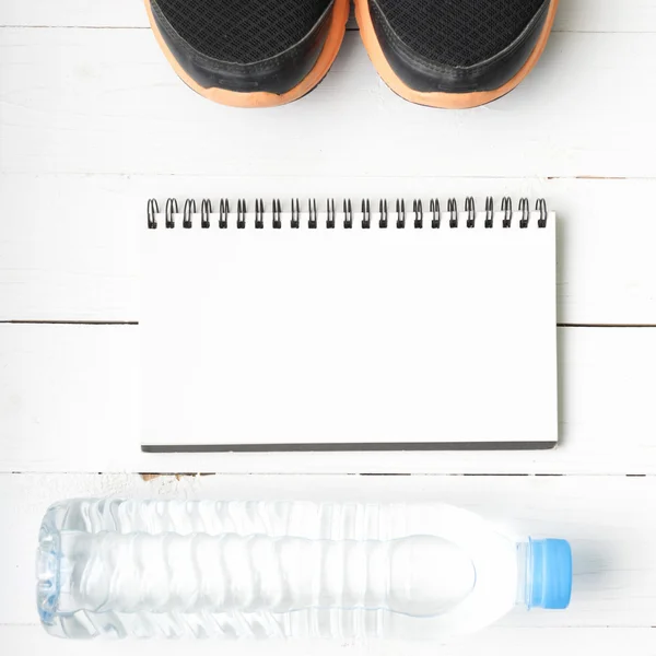 fitness equipment on white wood table