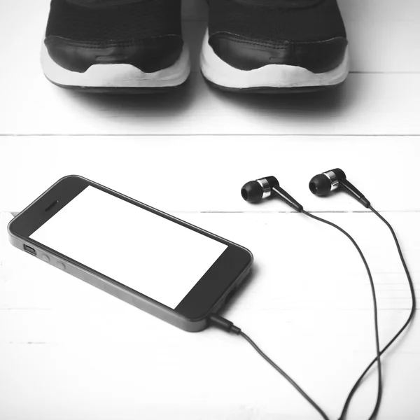 Running shoes and phone black and white tone color style — Stock Photo, Image