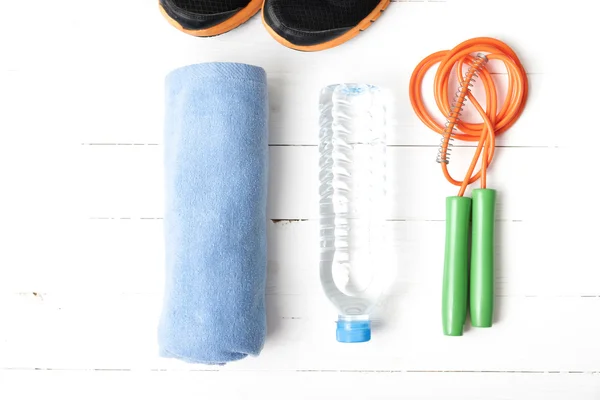 Fitness equipment on white wood table — Stock Photo, Image