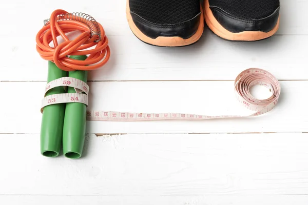 Fitness equipment on with wood table — Stock Photo, Image