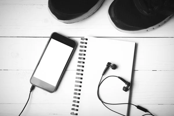 running shoes,notebook and phone black and white tone color styl