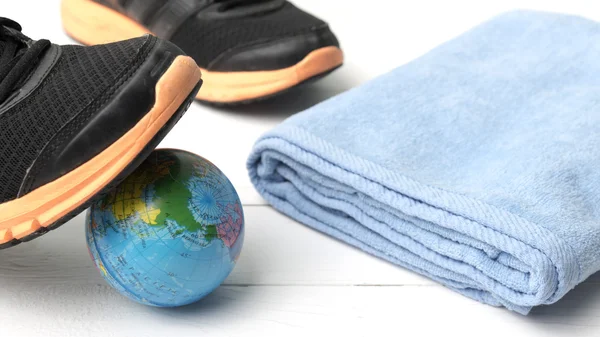 Running shoes,earth ball and towel — Stock Photo, Image