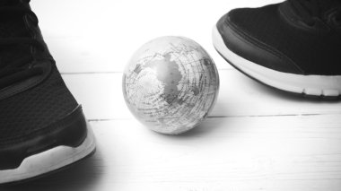 running shoes and earth ball black and white tone color style