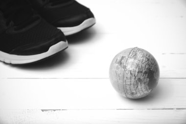 running shoes and earth ball black and white tone color style