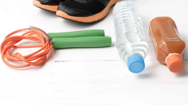 Fitness equipment on white wood background — Stock Photo, Image