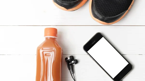 Buty do biegania, sok pomarańczowy i telefon — Zdjęcie stockowe