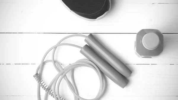 Fitness equipment on white wood background black and white tone — Stock Photo, Image