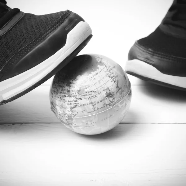 Running shoes and earth ball black and white tone color style — Stock Photo, Image