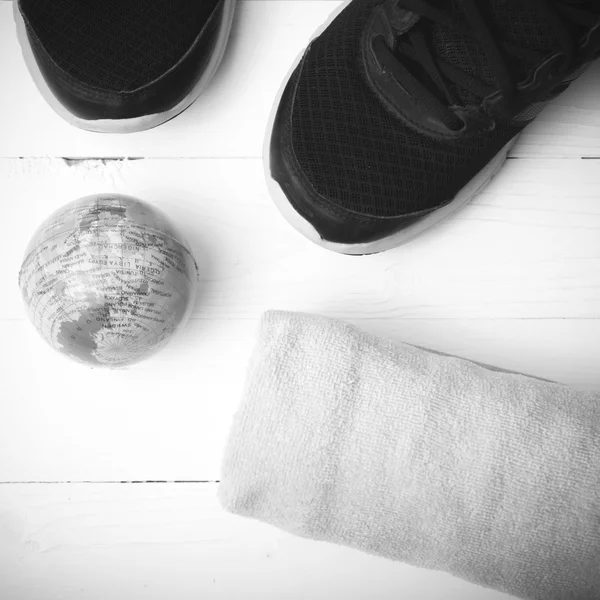Running shoes,earth ball and towel black and white tone color st — Φωτογραφία Αρχείου