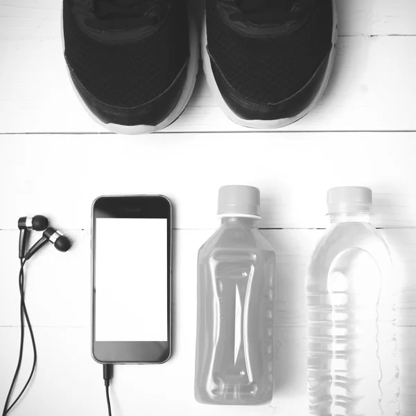 Running shoes,orange juice,drinking water and phone black and wh — Stock Photo, Image