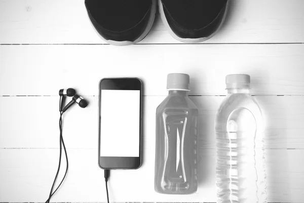 Running shoes,orange juice,drinking water and phone black and wh — Stock Photo, Image