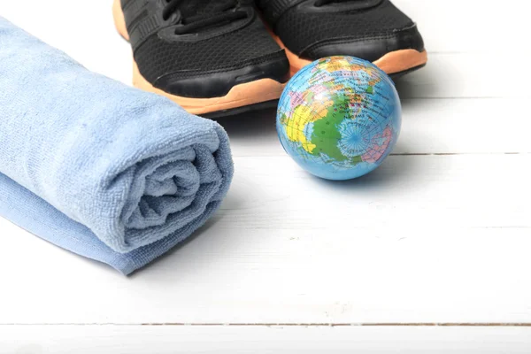 running shoes,earth ball and towel