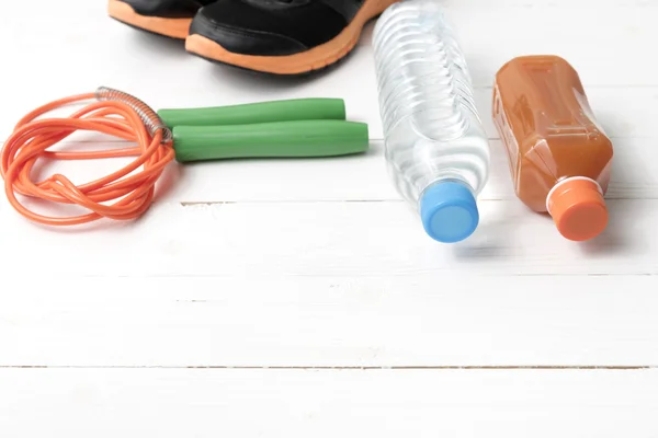 Fitness equipment on white wood background — Stock Photo, Image