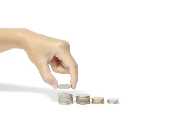 Mão colocando pilha de moedas — Fotografia de Stock