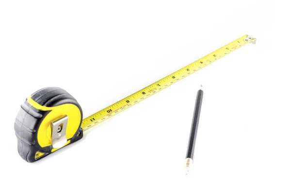 Измерительная лента с карандашом — стоковое фото