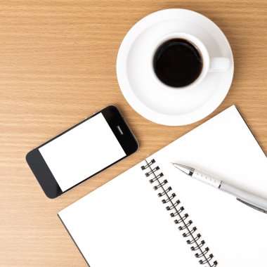 kahve fincanı ve telefon ve not defteri