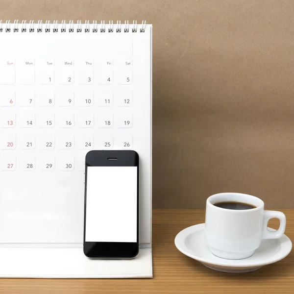 coffee cup and phone and calendar