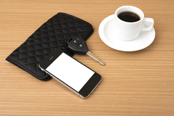 Coffee cup with phone car key and wallet — Stock Photo, Image