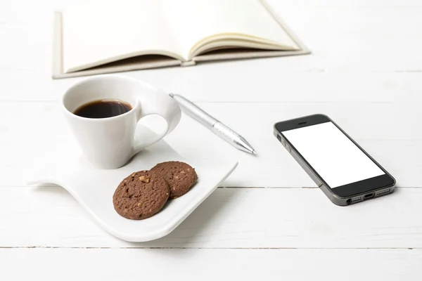 Coffee cup with cookie,phone with notebook and pen — Stock Photo, Image